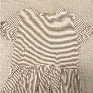 A pretty shirt with cute ruffles at the end